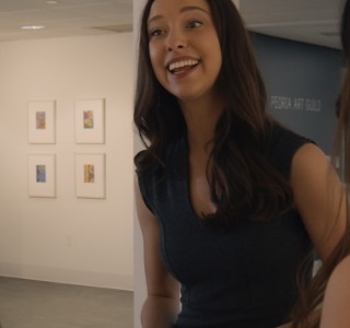 color-grading-short-film-woman-in-art-gallery-smiling